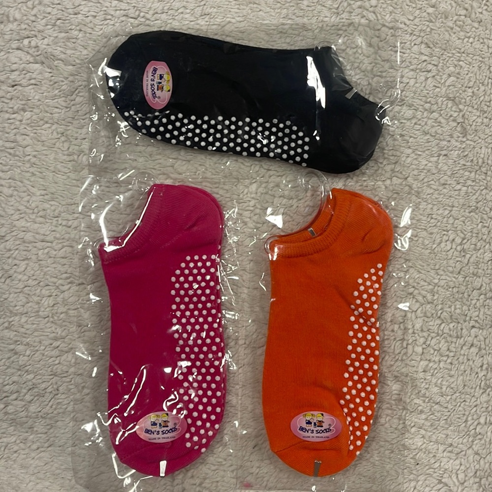 Grip socks.  Three (3) pairs Black, orange and pink new, brand is bens’s …